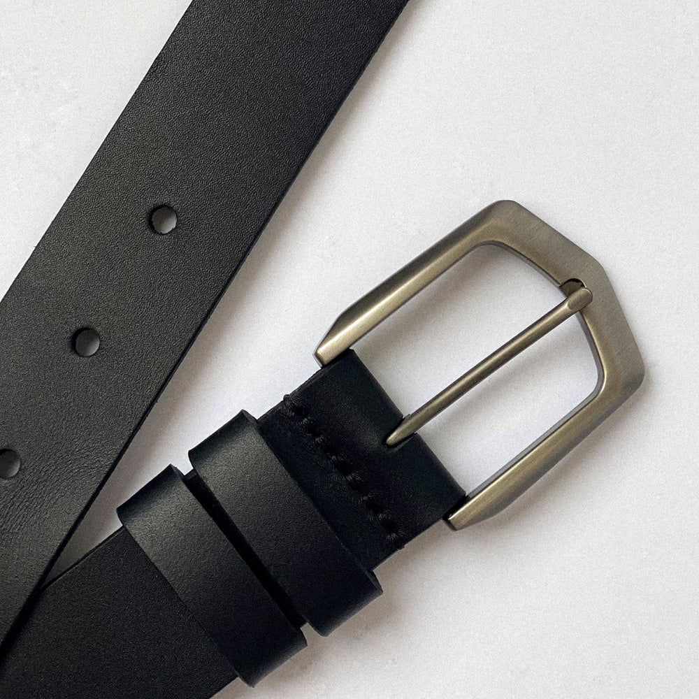 Black leather belt with gun steel buckle